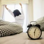 clock person bed couch